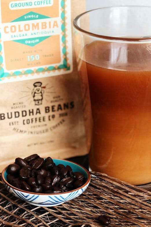Buddha Beans coffee beans and mug